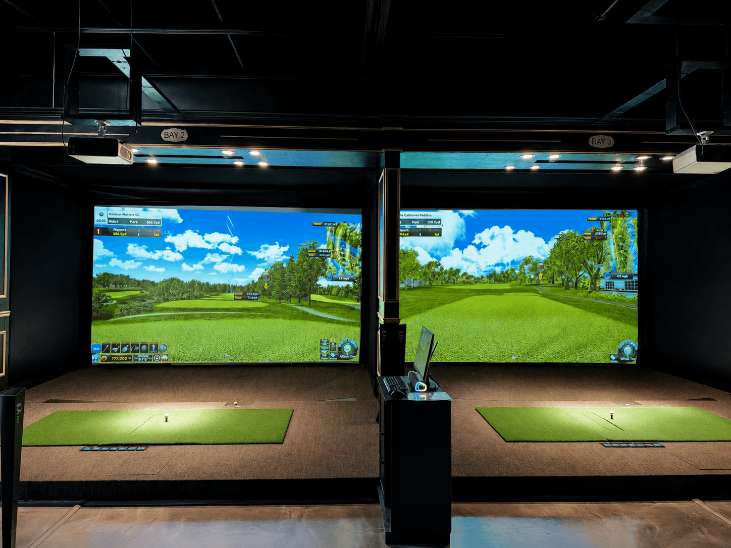 Golf simulator bays at HOME Sports Bar