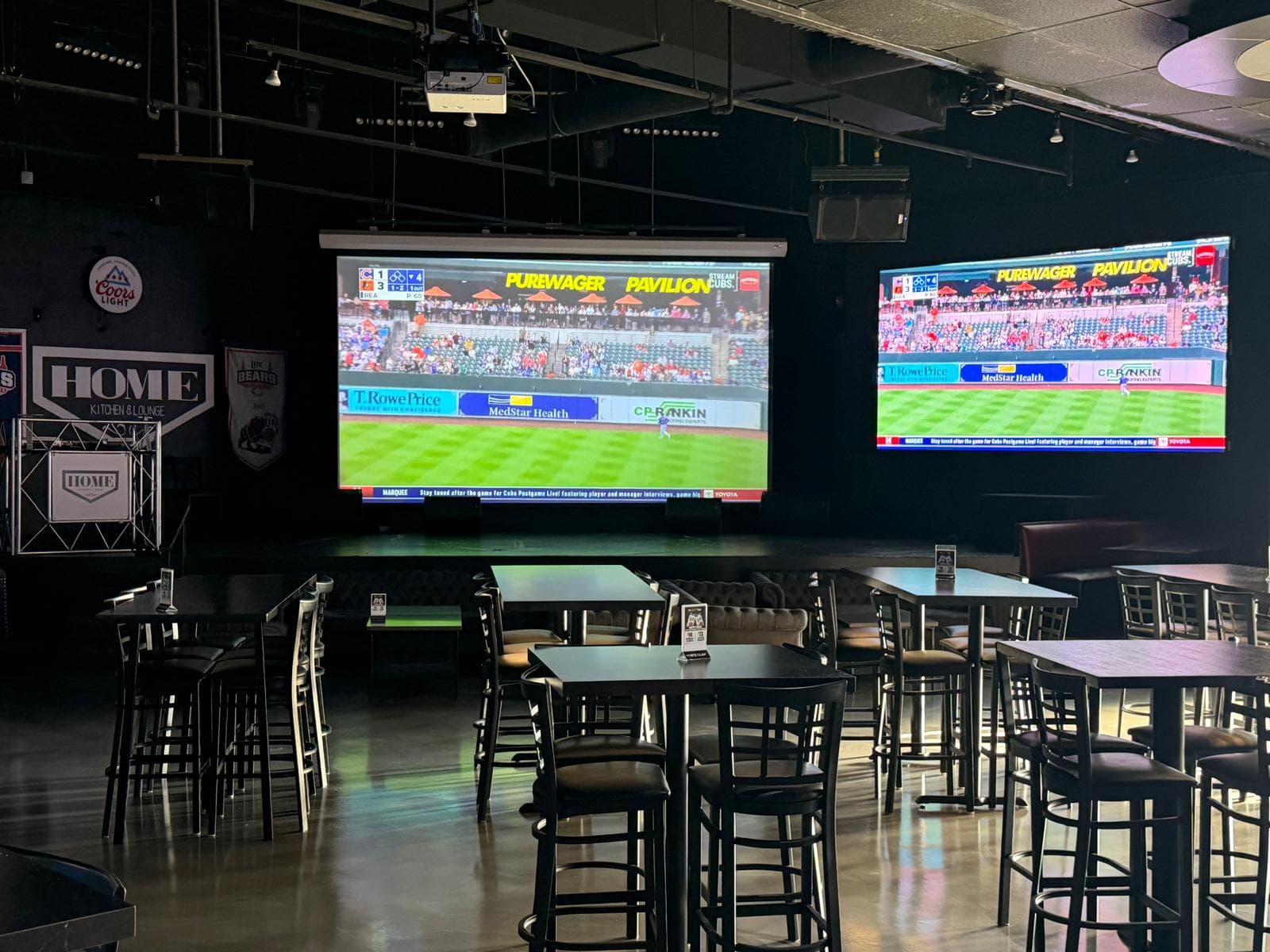 Large screen TVs showing sports at Home Bar Chicago